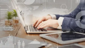 Digital marketing. Interactive screen with business processes over businessman typing on laptop